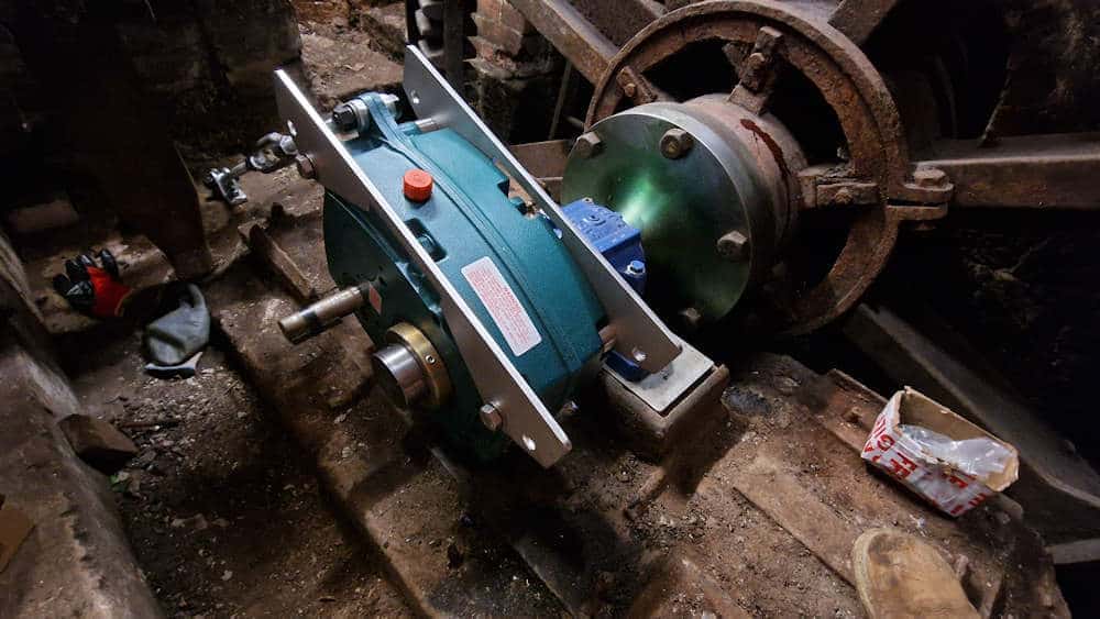 Side plates fitted to the gearbox to allow fitting of the generator baseplate