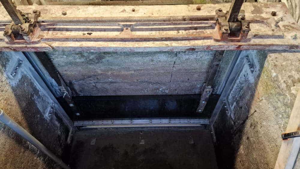 New sluice framework in place with the gaps around the framework sealed-up with underwater putty