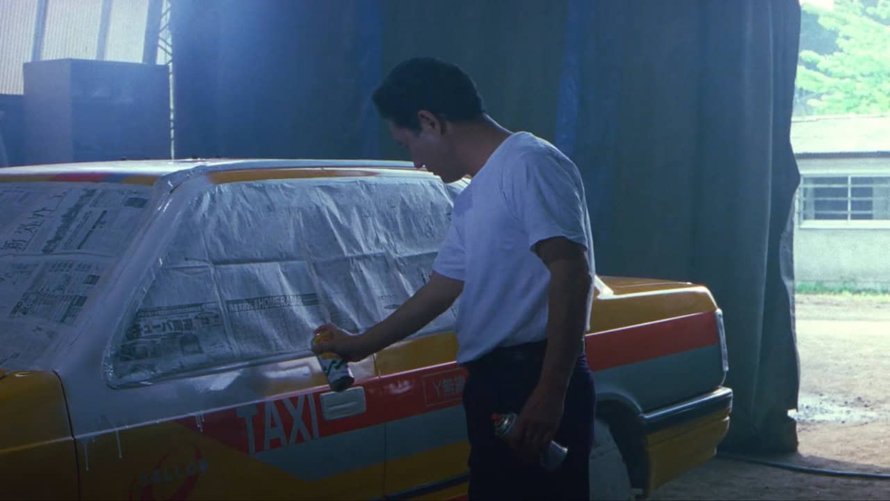 Takeshi Kitano in HANA-BI spray painting a taxi white