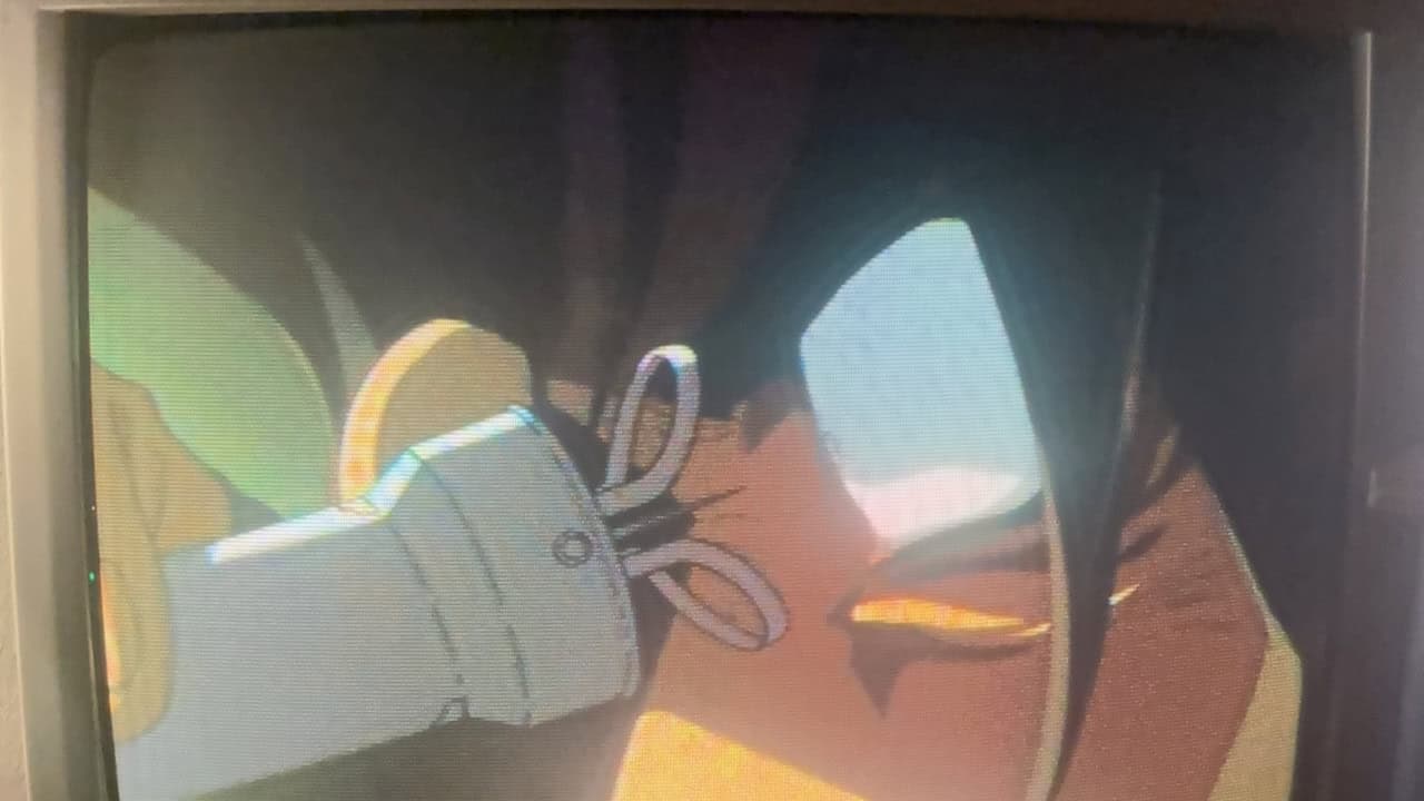 A close up of an eye and a machine in Cowboy Bebop on a CRT TV