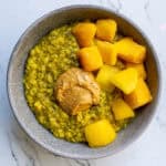 Creamy mango and chia seed pudding served with fresh, vibrant cubed mango pieces in a rustic bowl, perfect for a healthy, delicious breakfast or snack.
