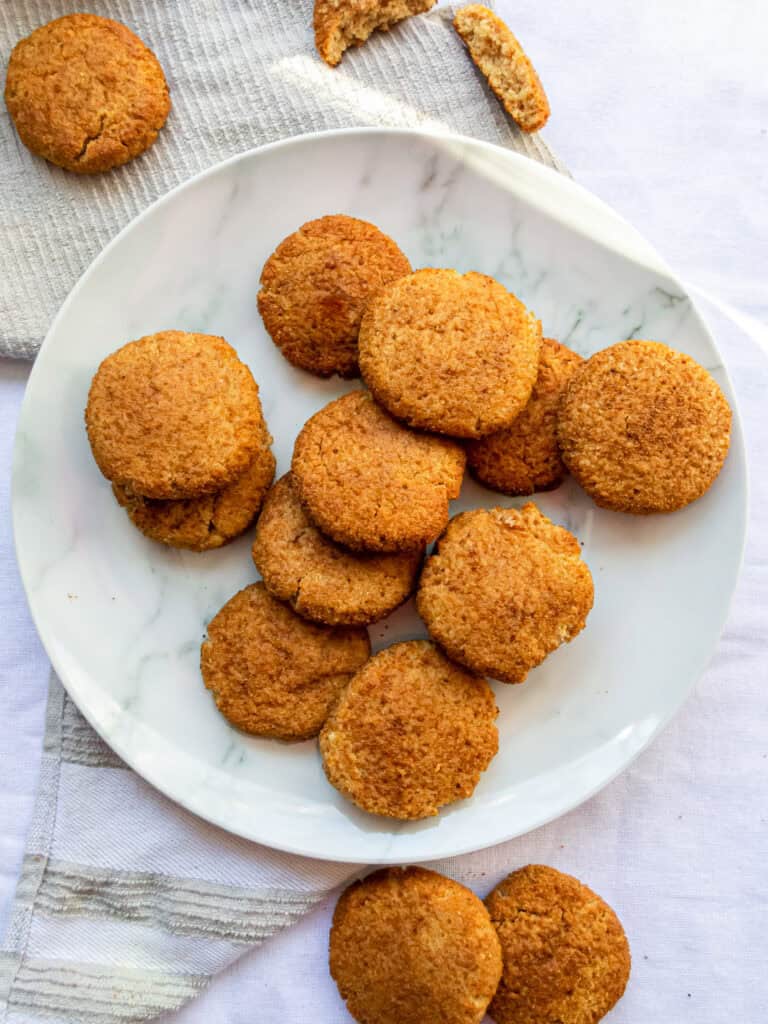 Golden fried chicken nuggets served on a white marble plate, showcasing crispy texture and inviting appeal. Perfect for snacks, kids' meals, or party appetizers, emphasizing fresh, homemade comfort food.