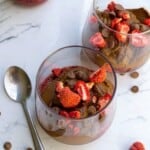 Rich chocolate pudding topped with fresh strawberries and chocolate chips in elegant glass dessert cups. Perfect for a decadent, fruity treat or dessert for any special occasion.