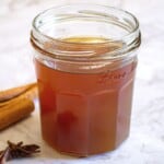 Sweet homemade caramel sauce in a glass jar, perfect for desserts and drizzles.