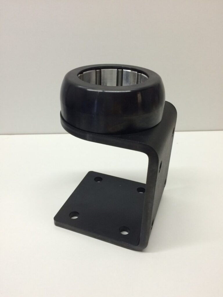 High-precision industrial bearing mounted on a sturdy black metal bracket for machinery applications.