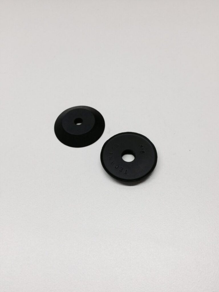 Black rubber weight bumpers for gym equipment or weightlifting.