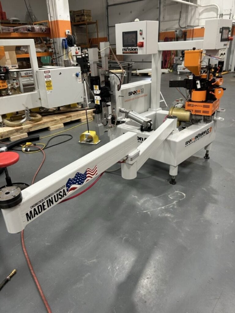 High-precision industrial robot arm used for manufacturing automation at SNX Technologies.