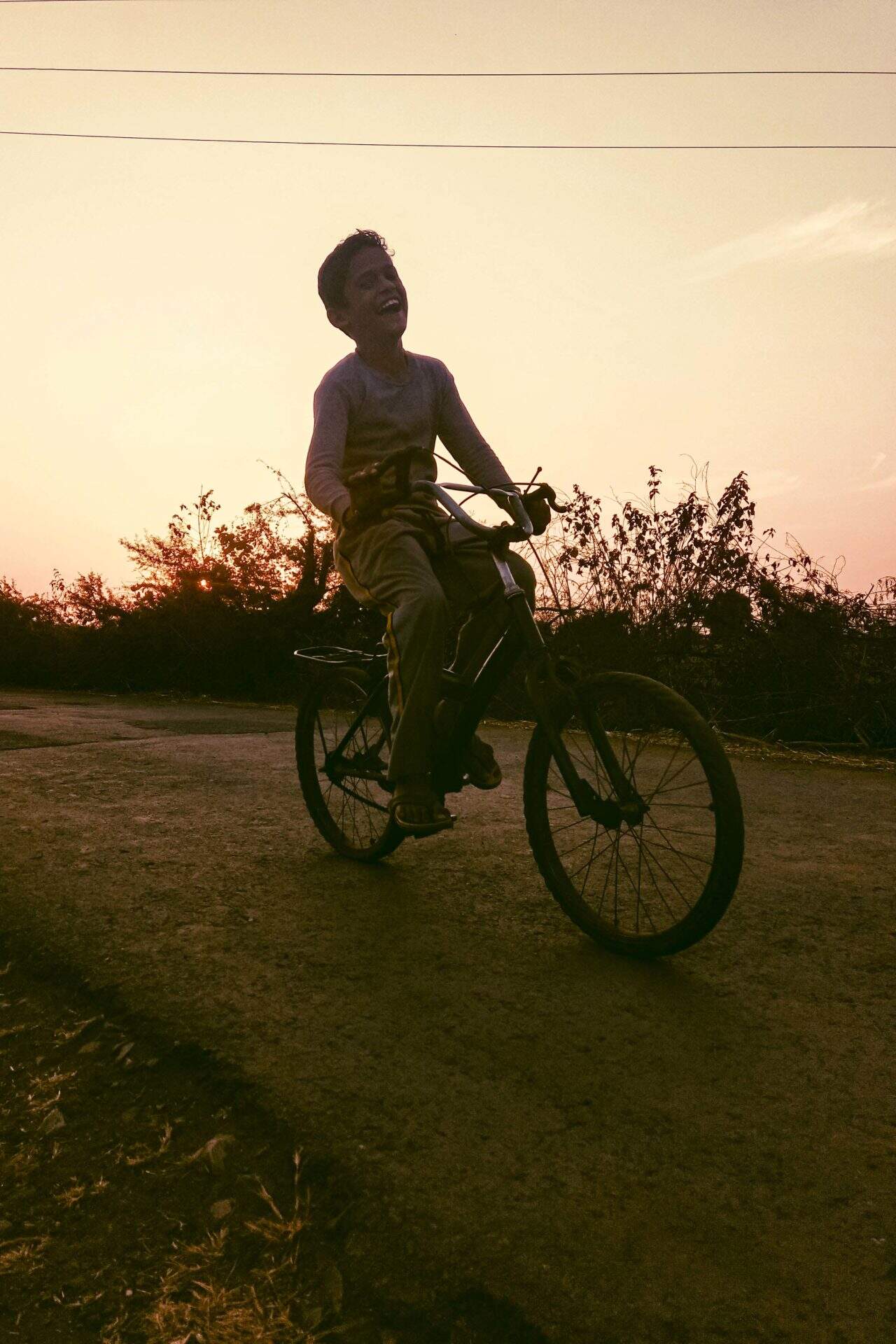 pexels-swapnil-sharma-crop boy on bicycle