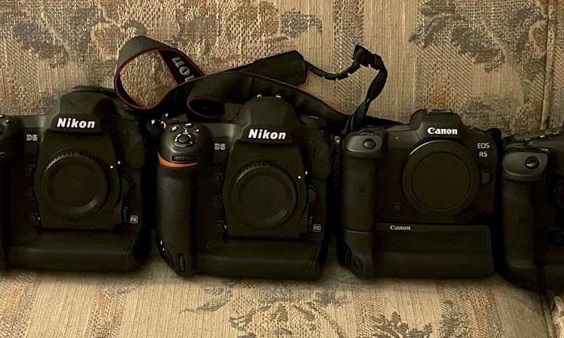 Nikon v Canon side by side on the sofa Dylan vidovich London wedding photographer