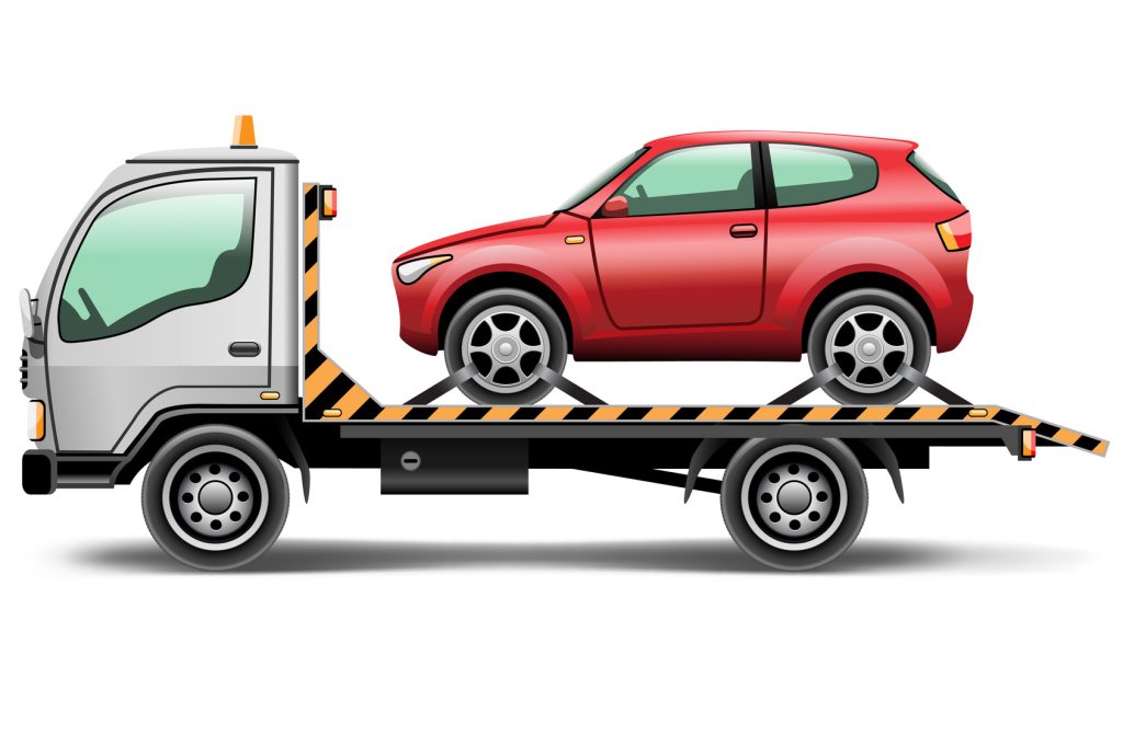 Tow truck hauling a red vehicle for roadside assistance and vehicle recovery services.