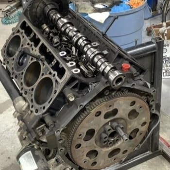 Engine camshaft and timing gear assembly for durability.