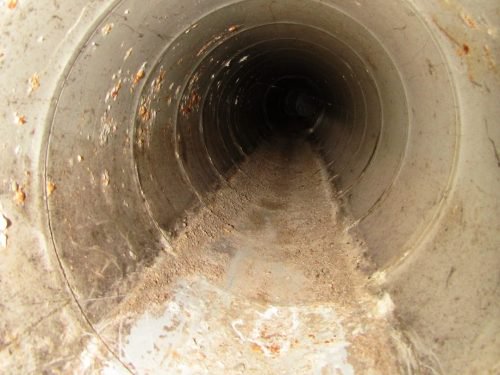transite duct with water stains
