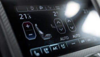 High-tech car climate control system with digital temperature and auto settings for comfort.