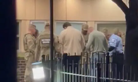 VIDEO: National Guard members, law enforcement pray outside hospital