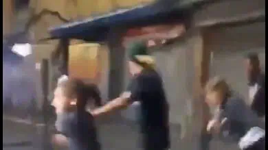 Video: Civilians are seen running for cover amid heave gunfire on the streets of Caracas