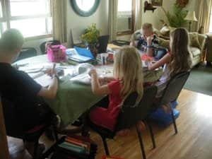 typical school day My kids doing their notebook pages (what a mess!)