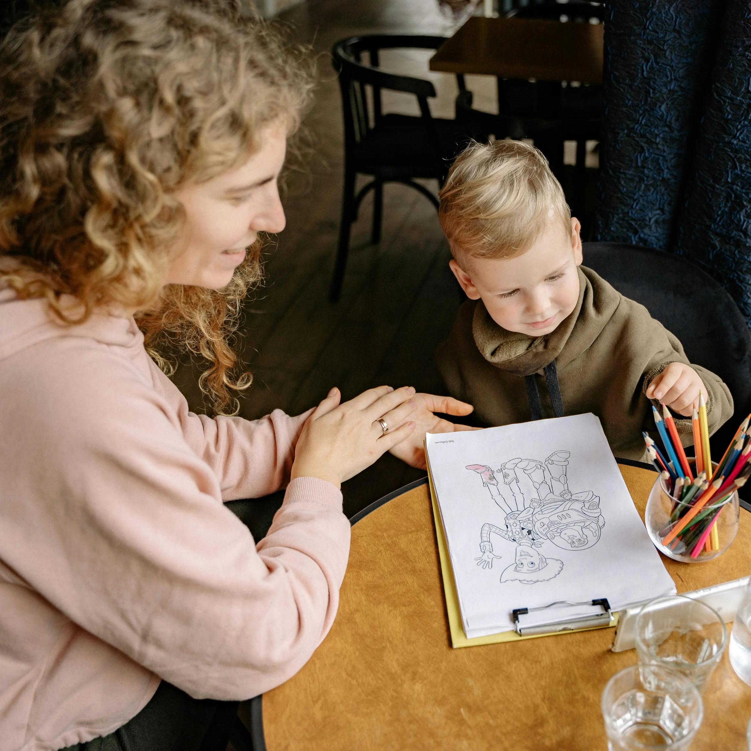 woman helping her kid with homeschooling (1)