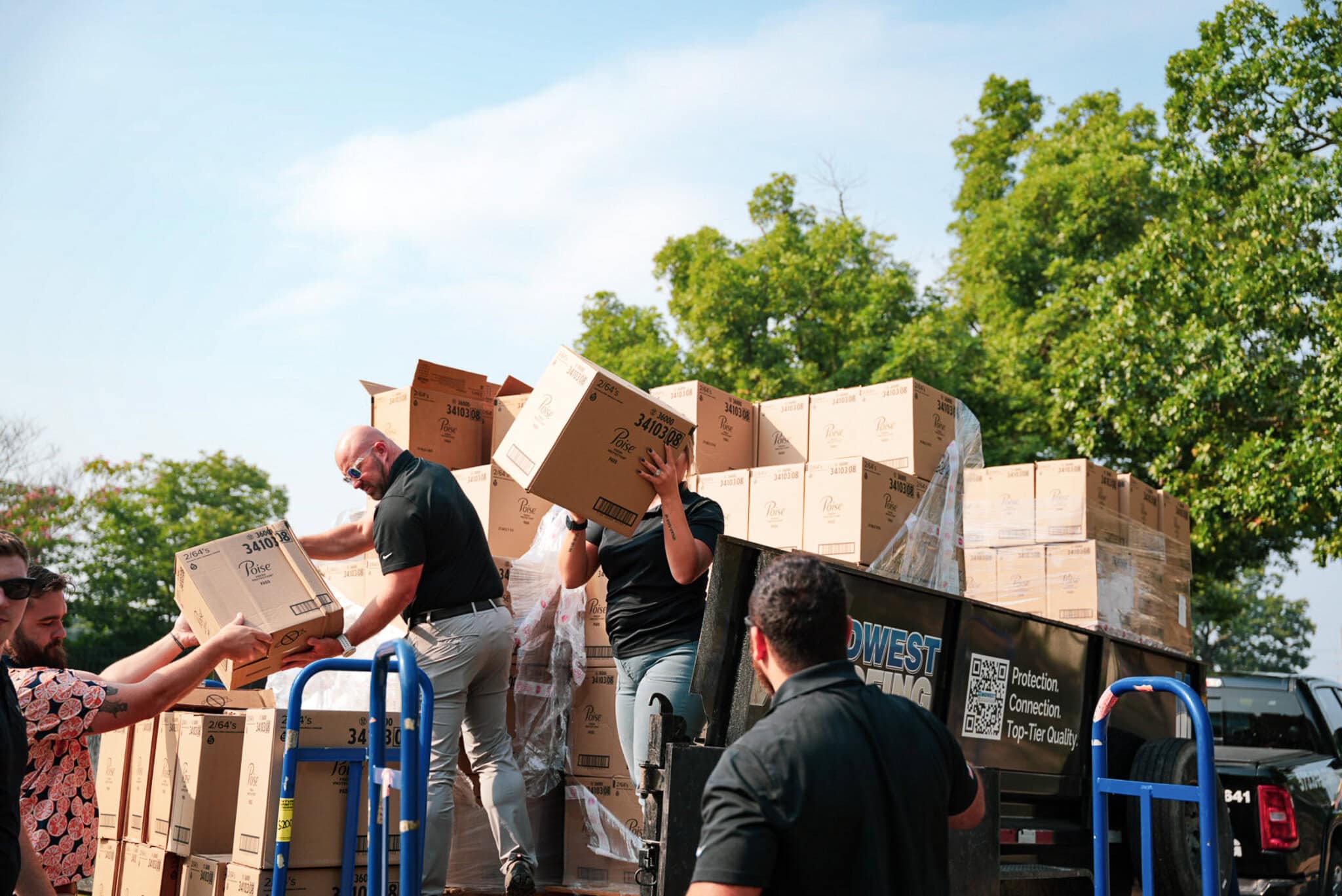 Efficient roofing material delivery team ensuring timely shipment for project.