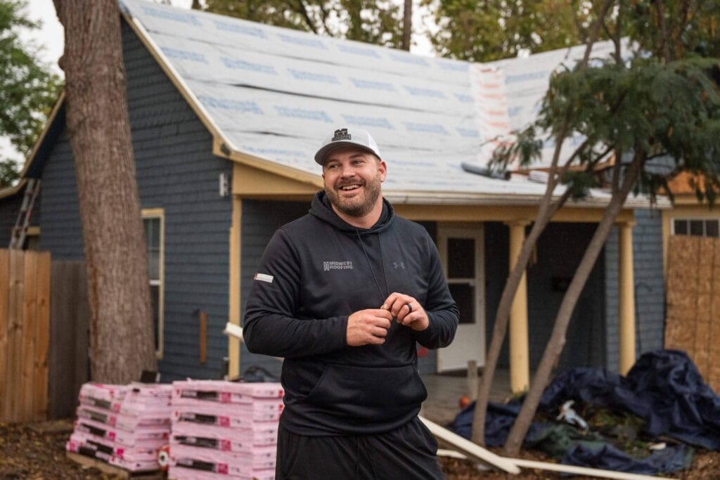 Friendly roofer at work demonstrating quality service.