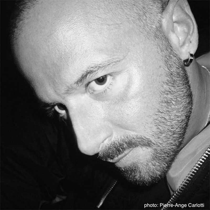 a black and white photo of a man with a bald head