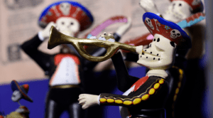 Día de Muertos comes alive at Epcot with festive mariachi skeletons playing instruments in vibrant, celebratory style.