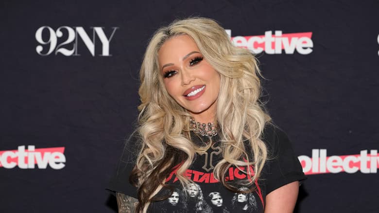 Bunnie Xo smiling big while posing at an event