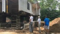 Picture of house jacked up to remove foundation