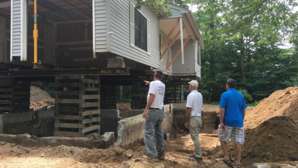 Picture of house jacked up to remove foundation