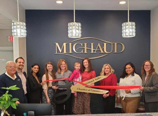 The nine members of the The Michaud team after the Chamber of Commerce award to Trudy Lawler