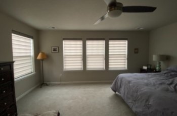 Designer banded shades installation in parker bedroom