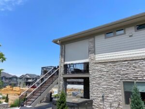 Durable outdoor patio shade installed on a modern home in Colorado, providing comfort and sun protec.