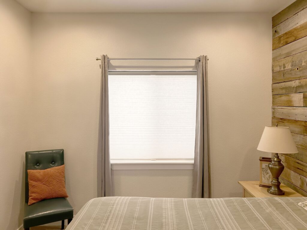 Hunter Douglas Duette Cellular Shades layered with curtains in Colorado home