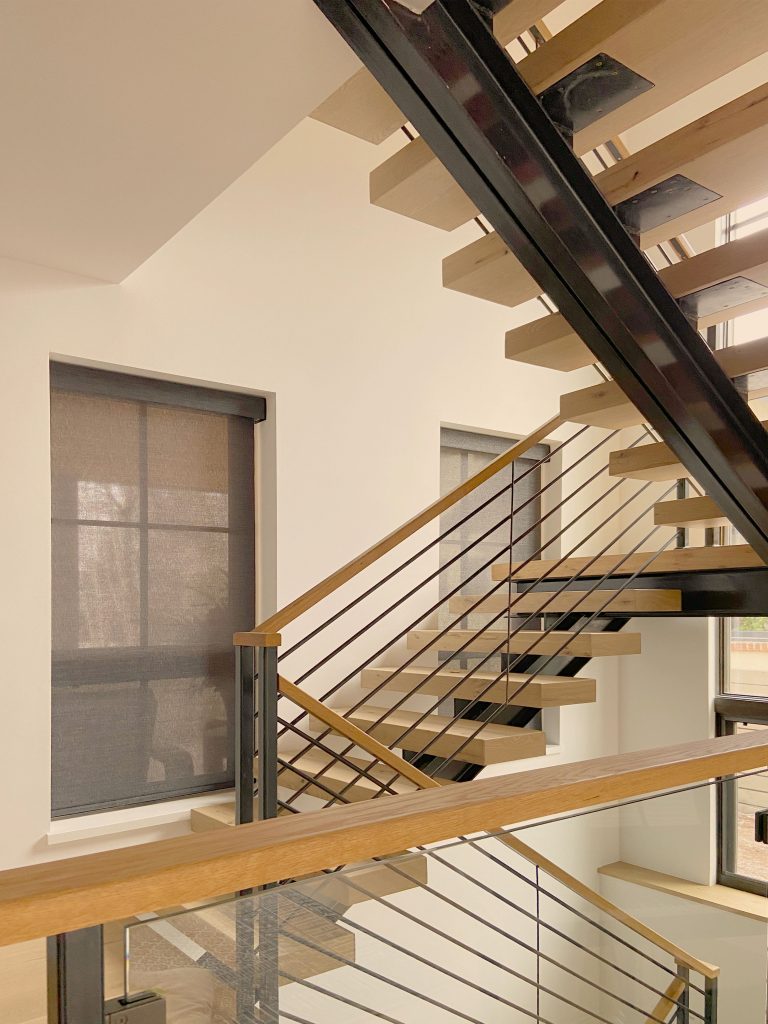 Hunter Douglas Designer Roller Shades with light-filtering fabric, Bottom Up design, and PowerView automation