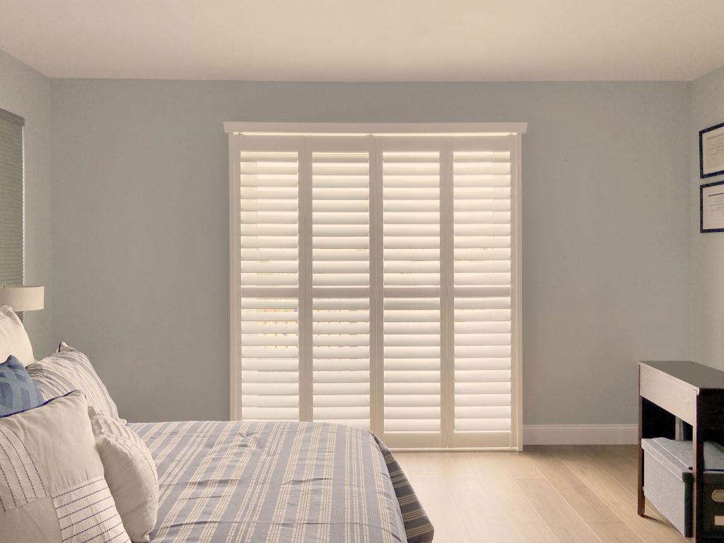 Hunter Douglas Palm Beach Polysatin Shutters with Hidden Tilt and bi-fold track system in Boulder homes