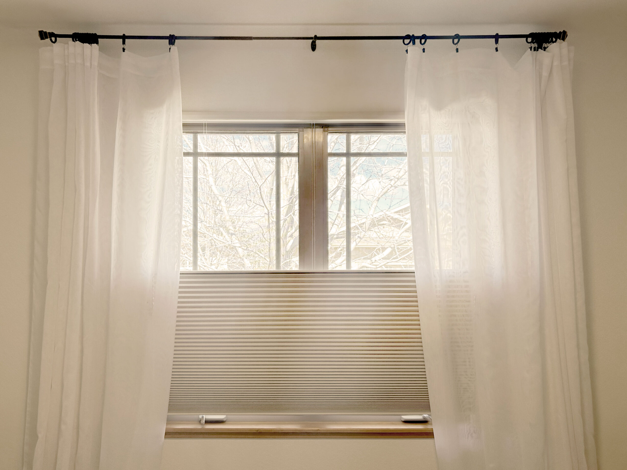 Hunter Douglas Applause Cellular Shades with LiteRise operation, Top-Down/Bottom-Up functionality, and room-darkening fabric offer flexible privacy and light control.