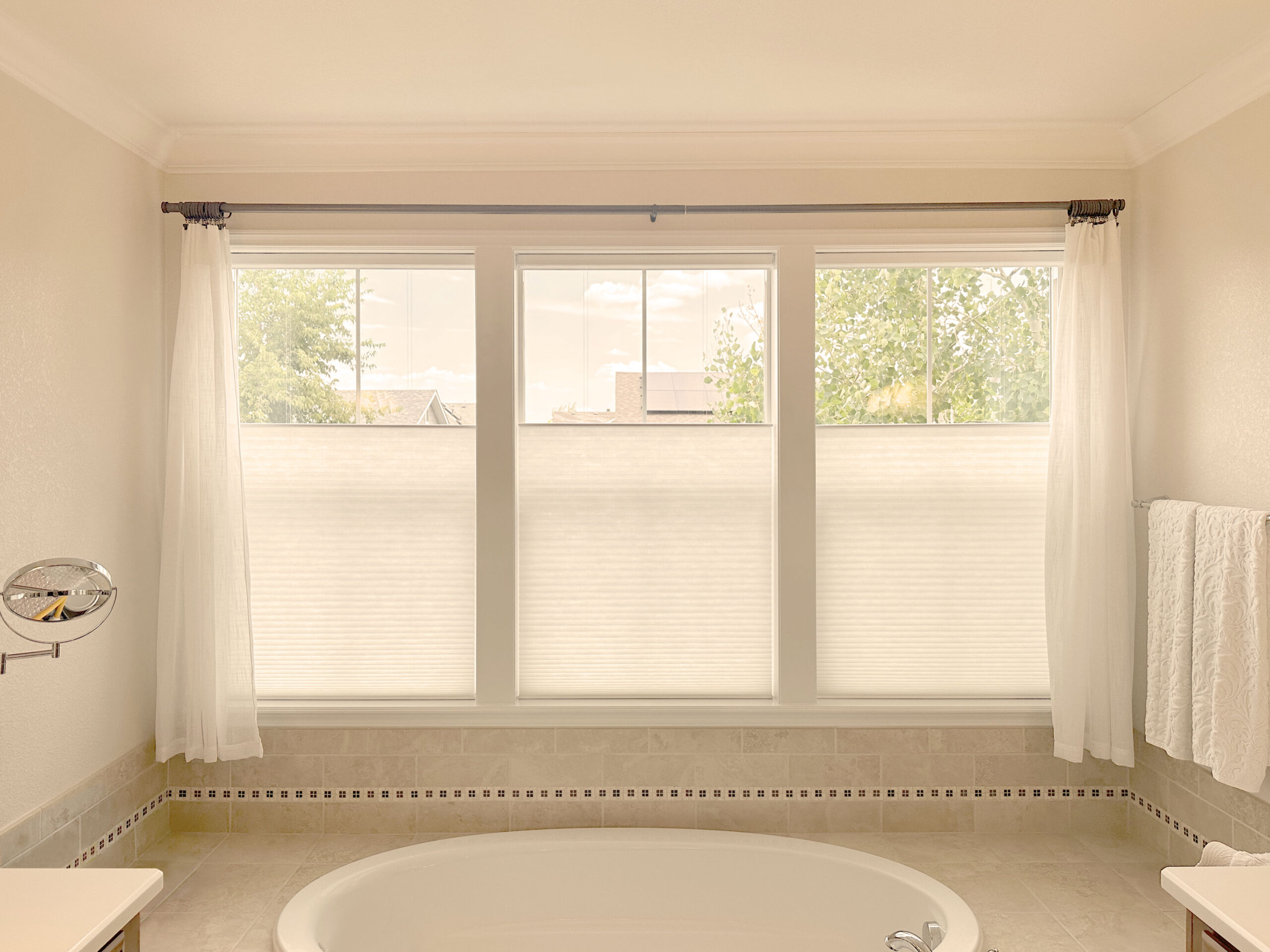 Hunter Douglas Applause Cellular Shades with PowerView motorization, Top-Down/Bottom-Up functionality, and light-filtering fabric offer flexible light and privacy control.