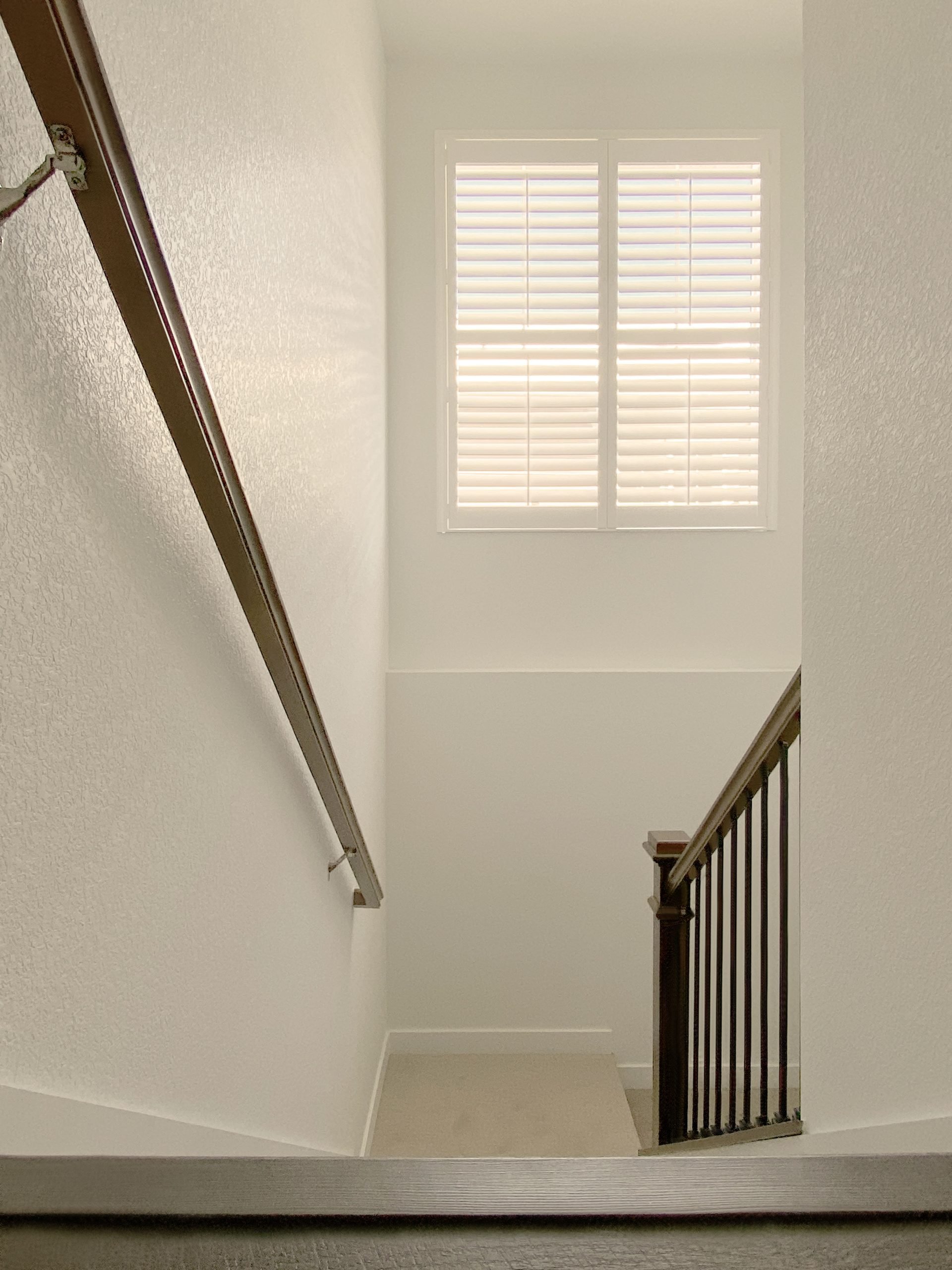 Hunter Douglas Palm Beach Polysatin Shutters with Front Center Tilt and Z Frame installation in Centennial homes