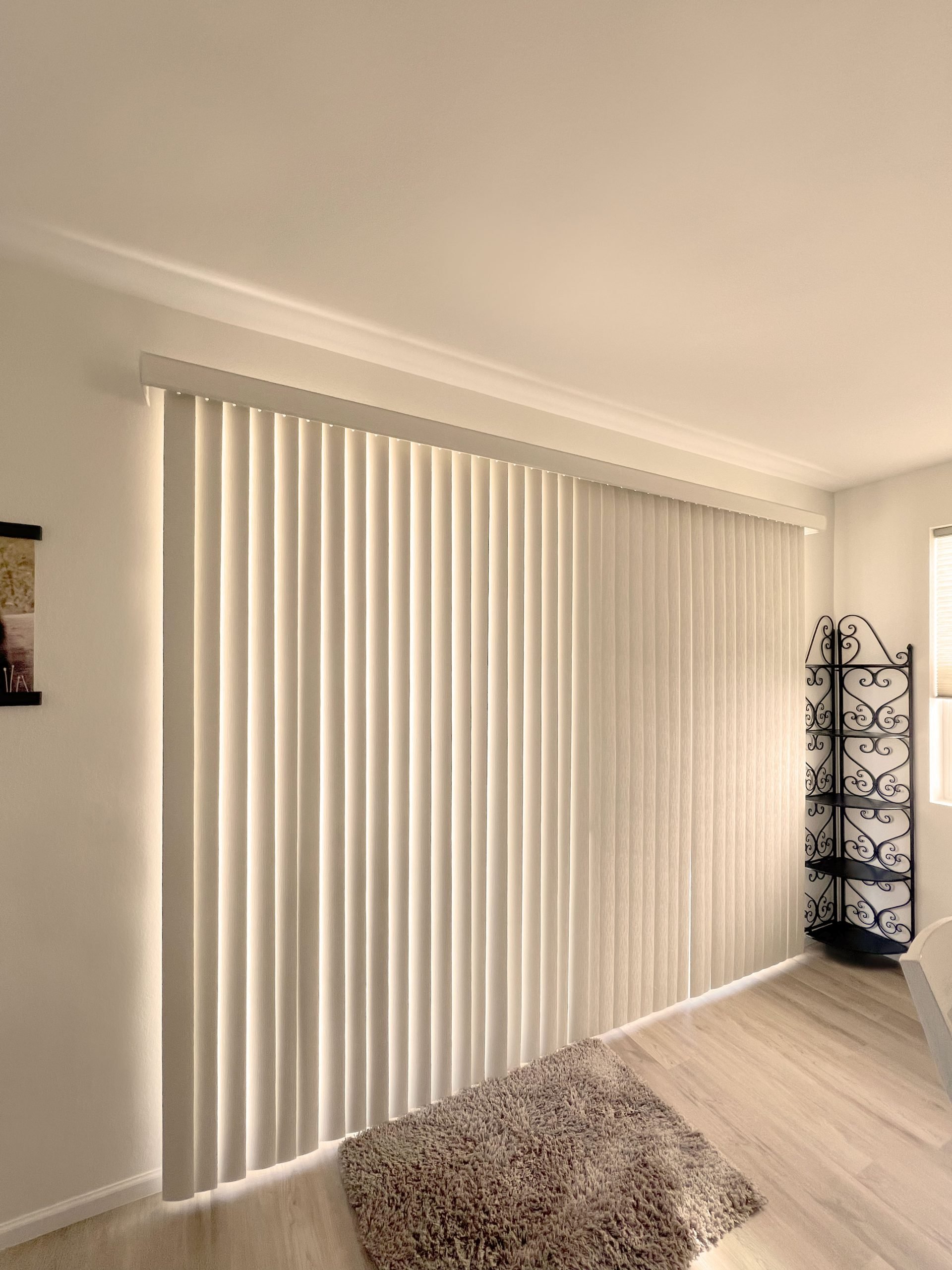 Hunter Douglas Vertical Solutions Vertical Blinds with wand control and split stack installed in Centennial homes