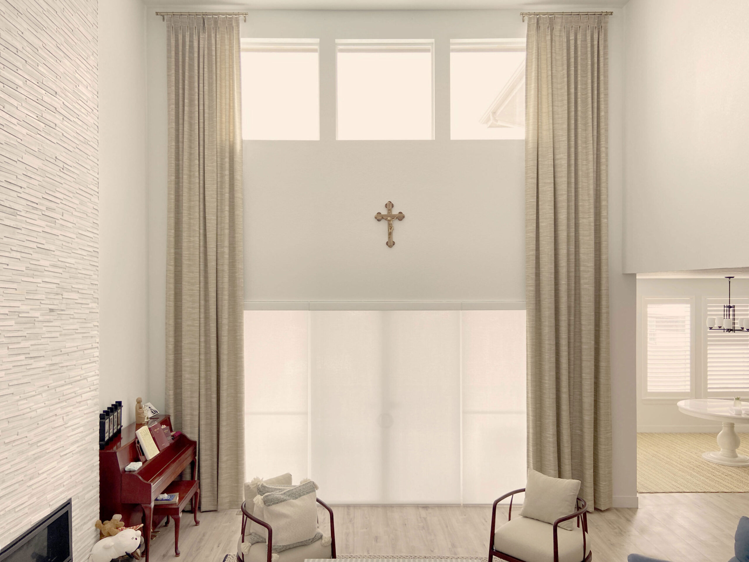 Hunter Douglas Designer Roller Shades with PowerView motorization paired with Palm Beach Polysatin Shutters featuring Hidden Tilt and Z Frame design, offering light-filtering performance and refined style.