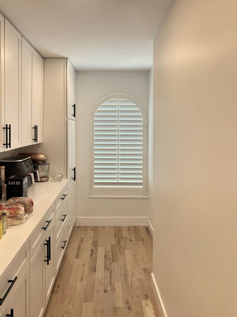 Hunter Douglas NewStyle Hybrid Shutters for Arched window in Colorado home