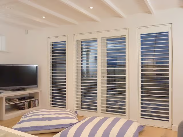 Hunter Douglas Palm Beach Polysatin Shutters with Hidden Tilt design and Z Frame installation.