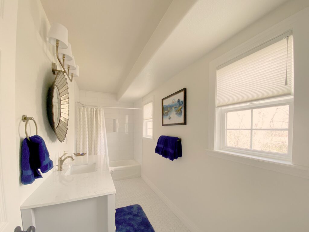 AURORA window shades installed in a bright bathroom, providing privacy and light filtering for a com.