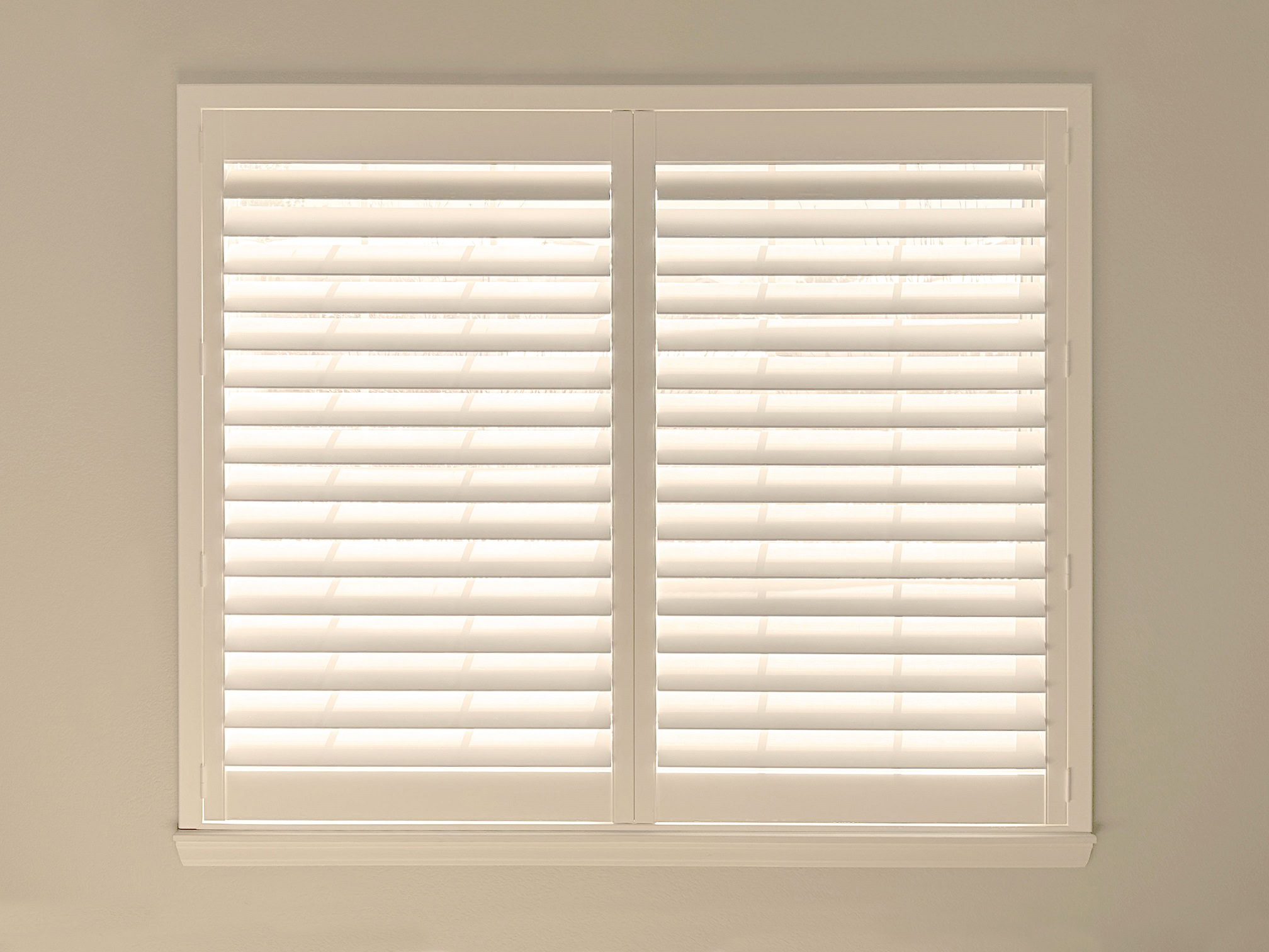 Custom white window shutters in Boulder for elegant window treatment solutions.