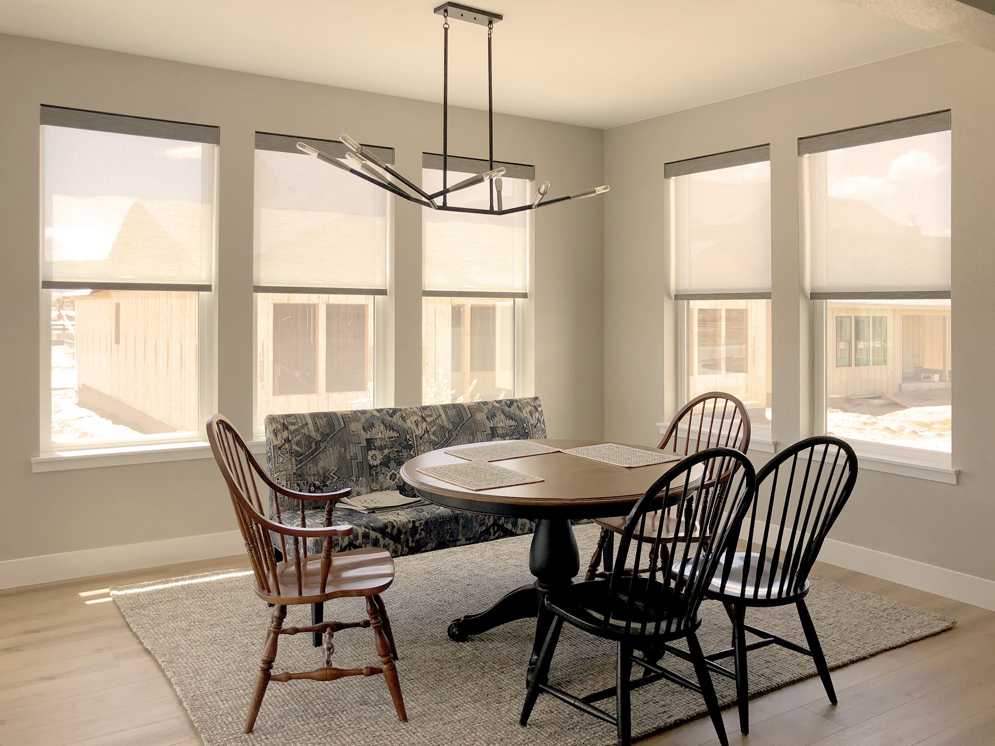 Bright dining room with large windows in Fort Collins residence.