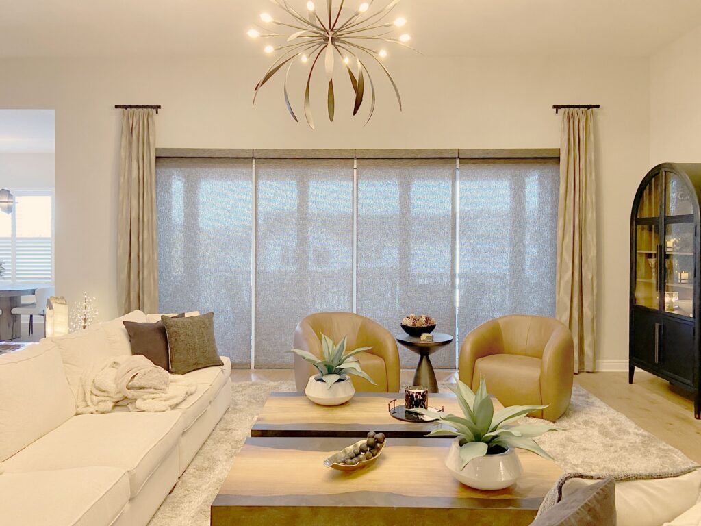 Motorized Hunter Douglas Designer Roller Shades with Carole Fabrics Side Panels for Colorado living room