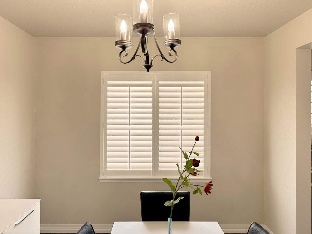 Hunter Douglas NewStyle Hybrid Shutters with Front Center Tilt operation and Z Frame design.