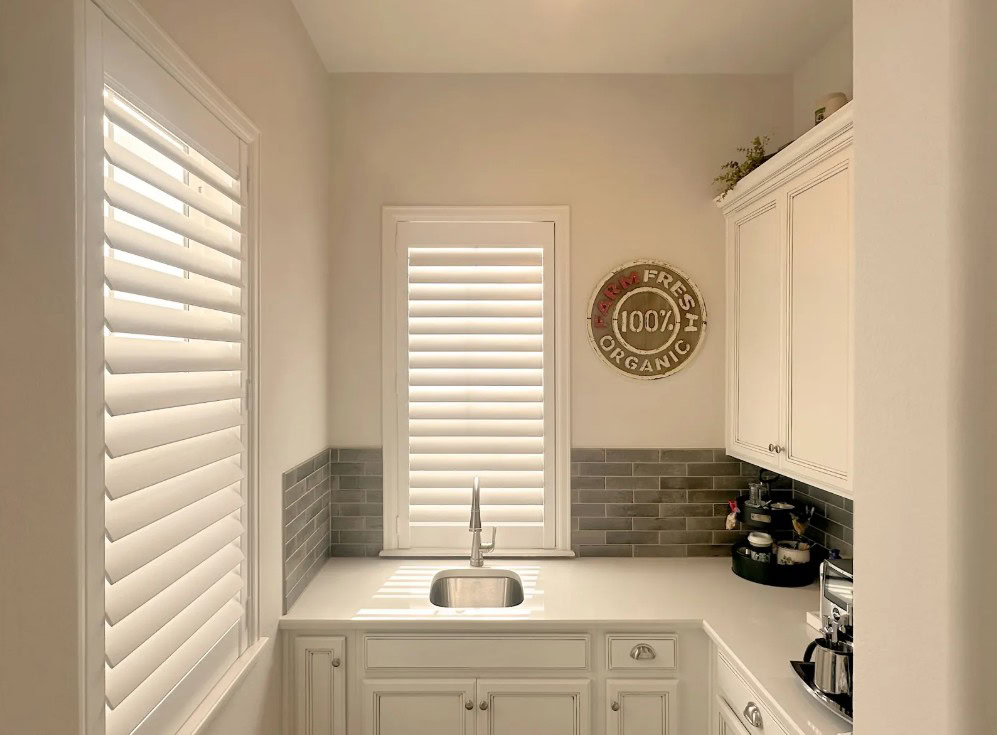 Hunter Douglas NewStyle Hybrid Shutters with Hidden Tilt operation, part of the Composite and Hybrid Shutters collection in Lakewood.