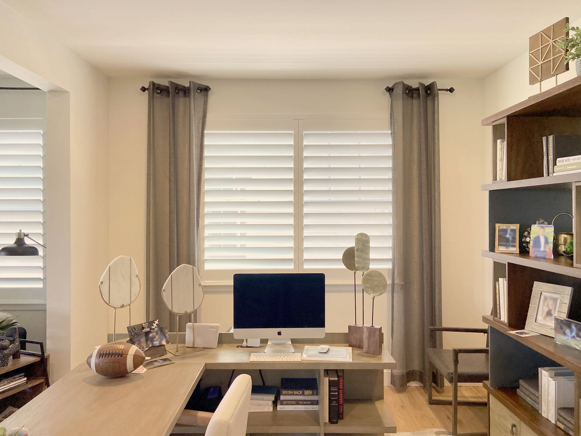 Hunter Douglas Palm Beach Polysatin Shutters paired with curtains for Colorado homes