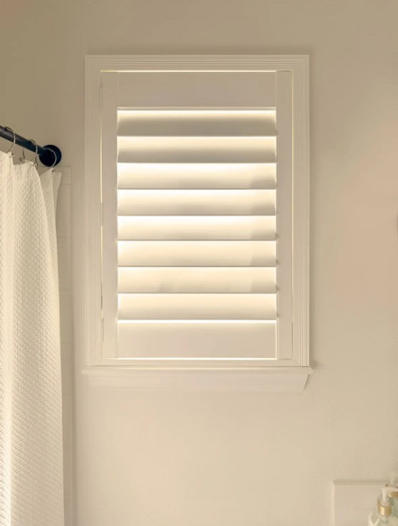 Hunter Douglas Palm Beach Polysatin Shutters with Hidden Tilt operation, part of the Custom Shutters collection in Lakewood.