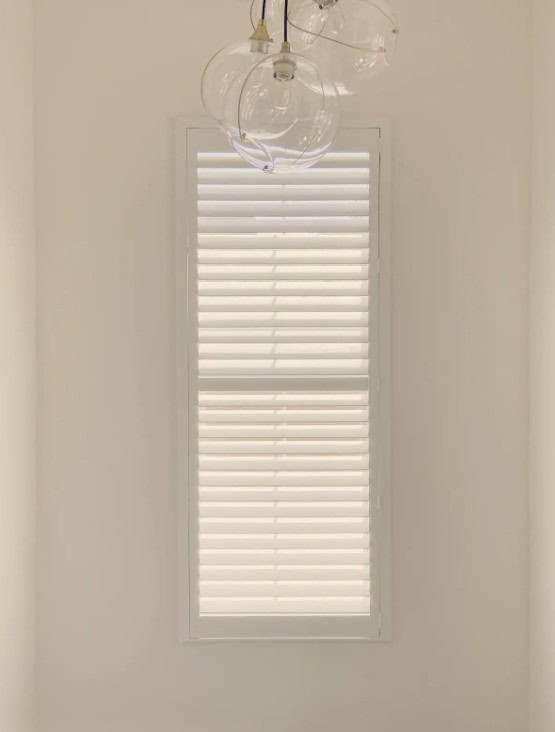 Hunter Douglas Palm Beach Polysatin Shutters with Hidden Tilt operation, part of the Motorized Interior Shutters collection in Lakewood.